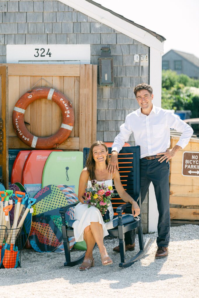 Bride and groom outside Millie's Market Nantucket after eloping on the beach.